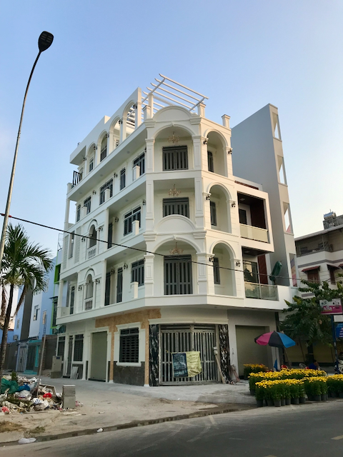 A modern building in Ho Chi Minh City, Vietnam, with improperly used neoclassical elements.